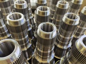 CNC gear hobbing operation on forged steel axle gear blank
